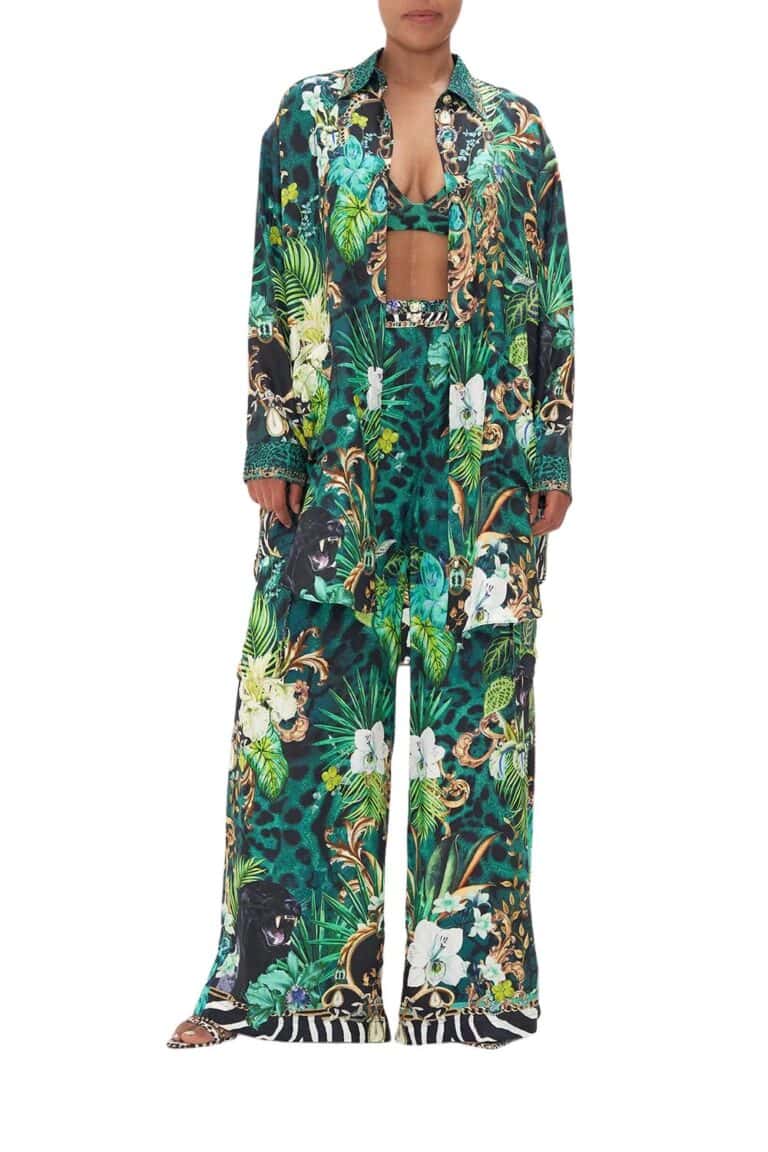 Front side of green floral print silk shirt from Camilla high summer 2023 collection with matching silk wide pants.
