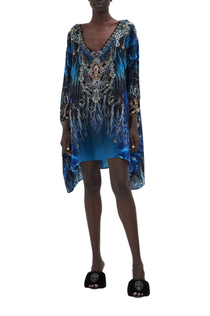 Front view of short silk kaftan on model from Camilla in black based print with blue highlights and embellishments.