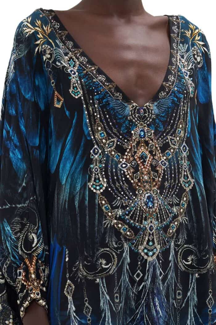 Front detailed top view of short silk kaftan from Camilla in black based print with blue highlights and embellishments.